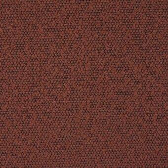 Reddish-brown granular texture with irregular, rounded particles on a dark grid base, creating a speckled, matte, woven composite material.